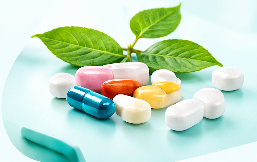 Capsules and green leaf