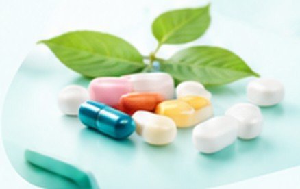 Capsules and green leaf